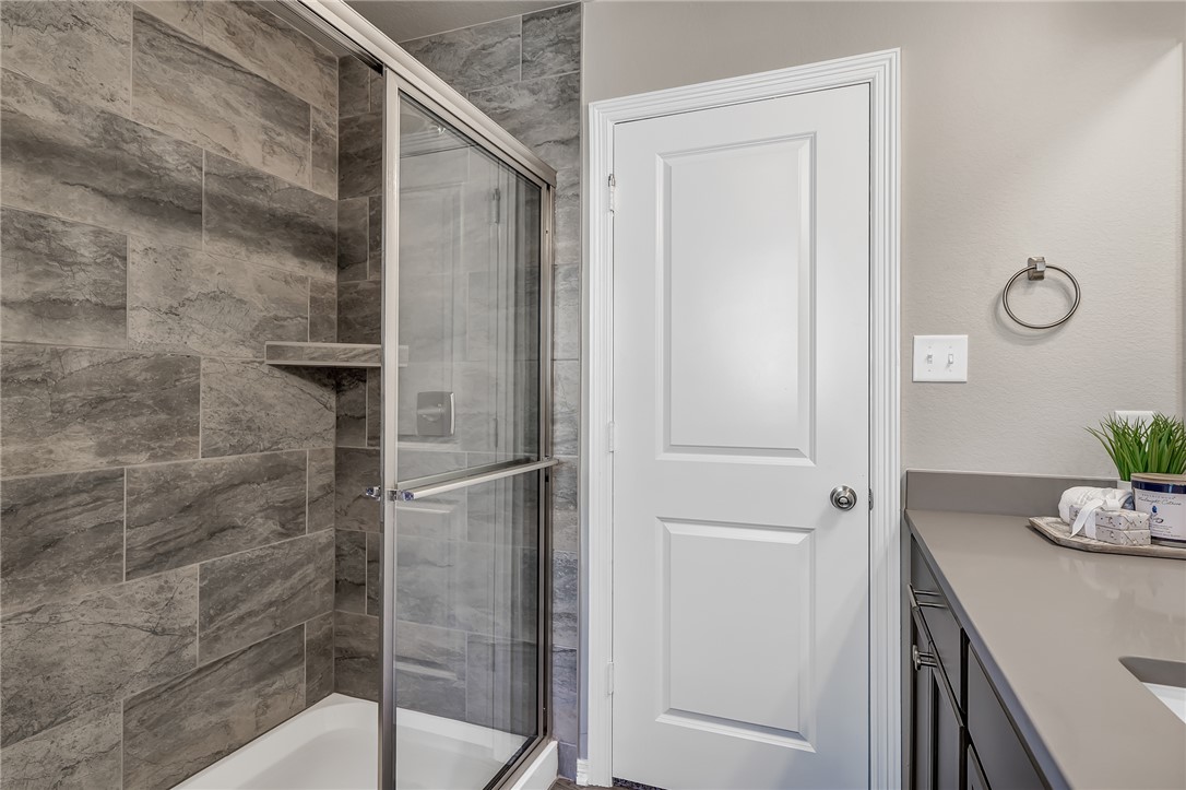 1220 High Street Navasota, TX 77868 - Photo 14 of 17 a bathroom with a shower and vanity