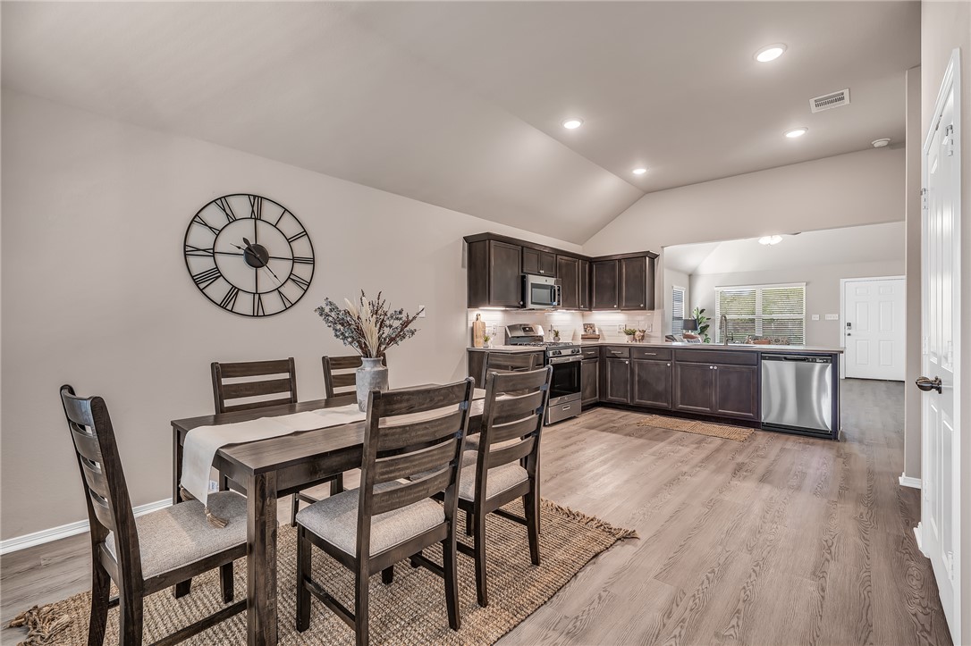 1220 High Street Navasota, TX 77868 - Photo 10 of 17 a view of a dining room with furniture and wooden floor