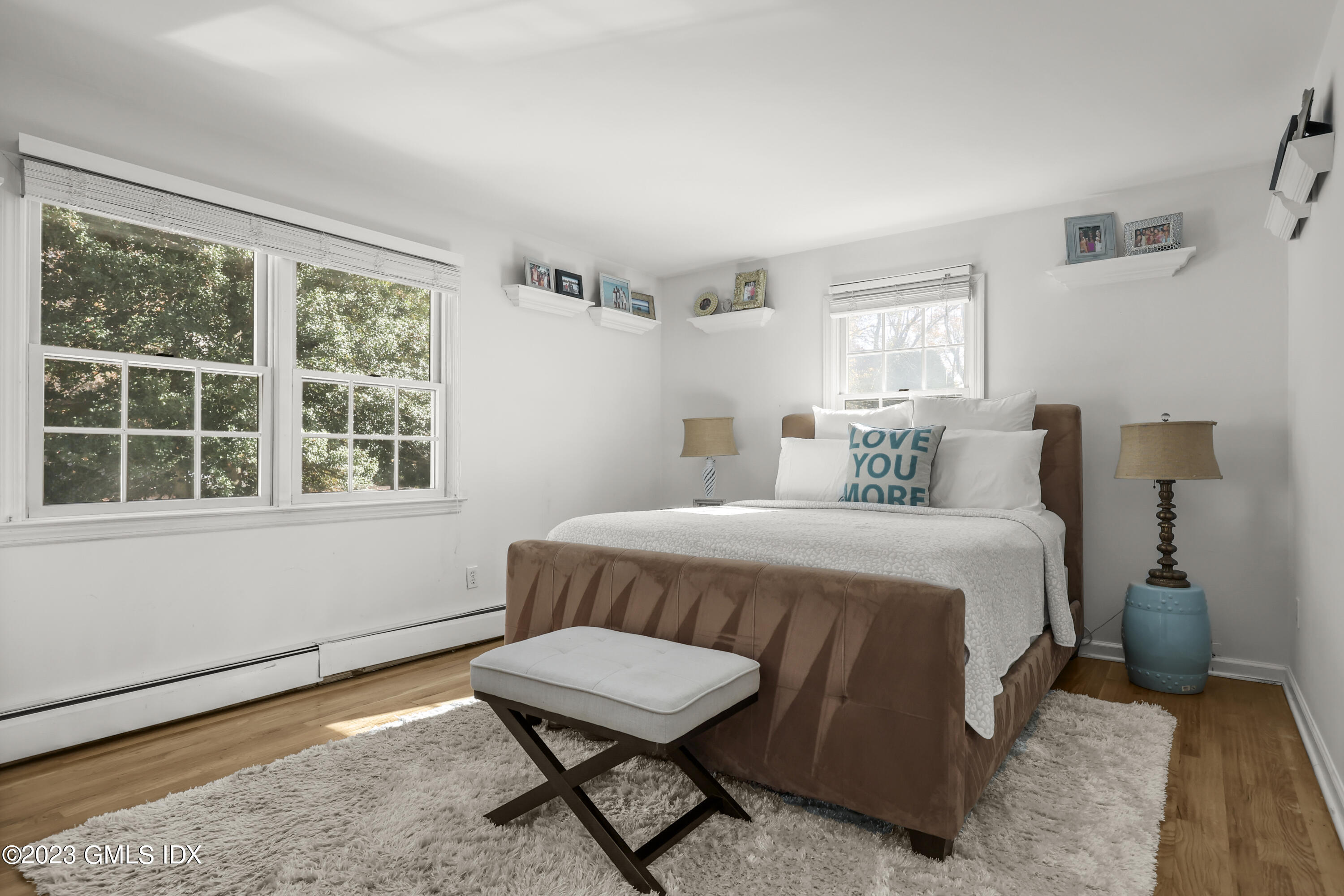 14 Rainbow Drive Riverside, CT 06878 - Photo 20 of 29 a bedroom with a bed and wooden floor