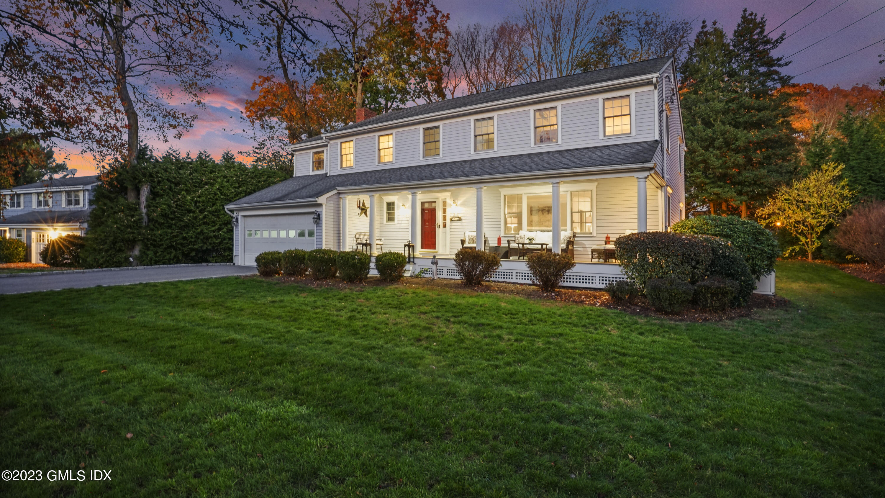 14 Rainbow Drive Riverside, CT 06878 - Photo 24 of 29 a front view of a house with a garden and plants