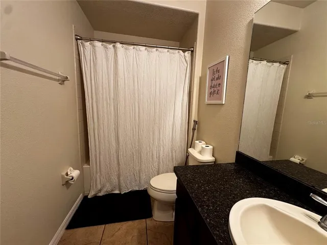a bathroom with a bathtub and a sink