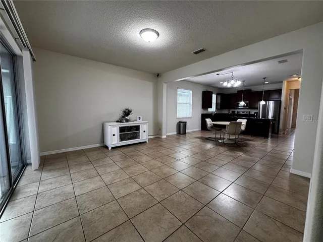 a view of a livingroom with furniture and a window