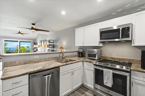 a kitchen with a stove and a microwave