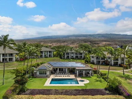 a view of a swimming pool with a yard