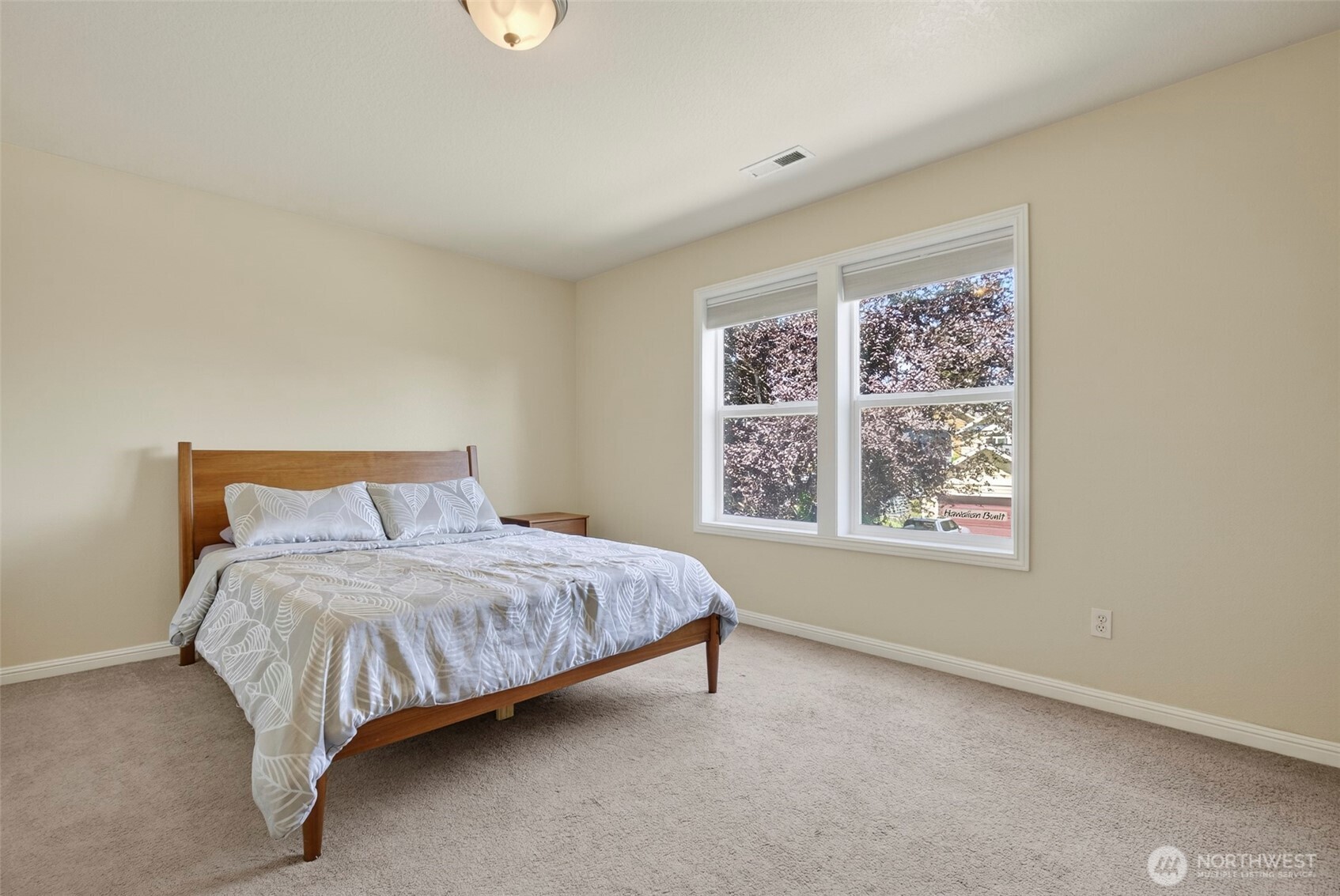 16715 Northeast 5th Street Vancouver, WA 98684 - Photo 24 of 34 a bedroom with a bed lamp and window