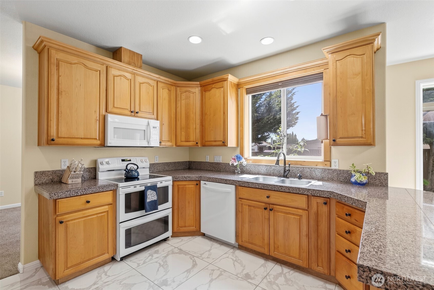 16715 Northeast 5th Street Vancouver, WA 98684 - Photo 5 of 34 a kitchen with stainless steel appliances granite countertop a sink stove and cabinets