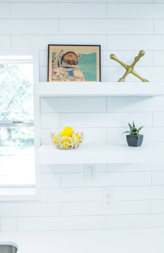 1913 Rabb Road, Unit B Austin, TX 78704 - Photo 2 of 10 Minimalist built-in shelving offers smart storage against a bright, clean wall.
