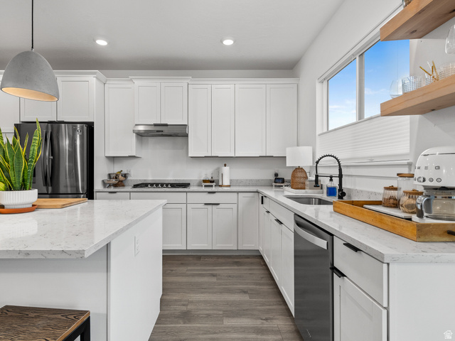 627 South Meade Street Mapleton, UT 84664 - Photo 9 of 37 Bright kitchen featuring white cabinetry, light-toned countertops, and wood-finish flooring