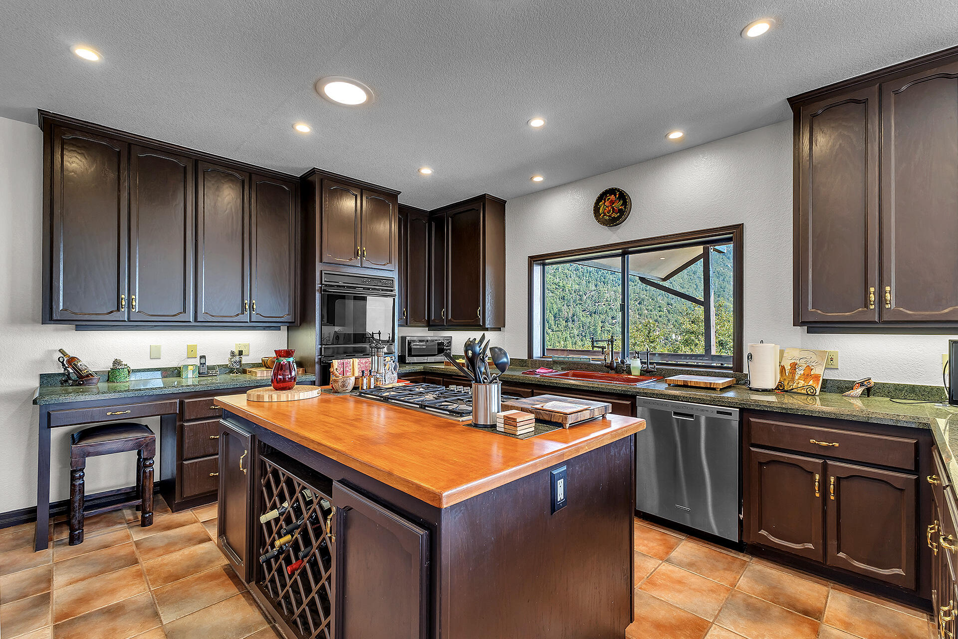 24740 Pioneer Road Idyllwild, CA 92549 - Photo 12 of 59 a kitchen with a sink stove top oven and cabinets