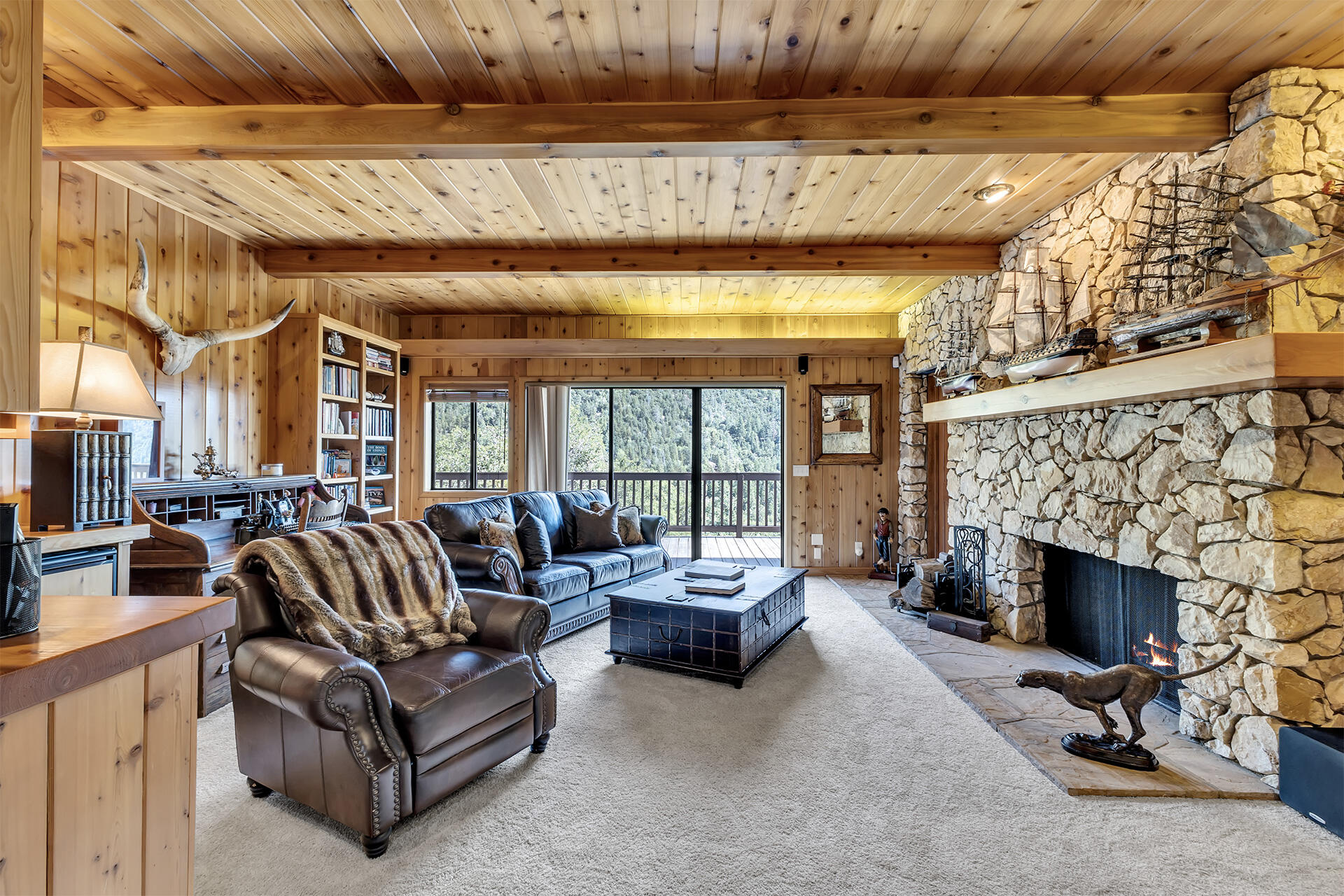 24740 Pioneer Road Idyllwild, CA 92549 - Photo 20 of 59 a living room with furniture and a fireplace