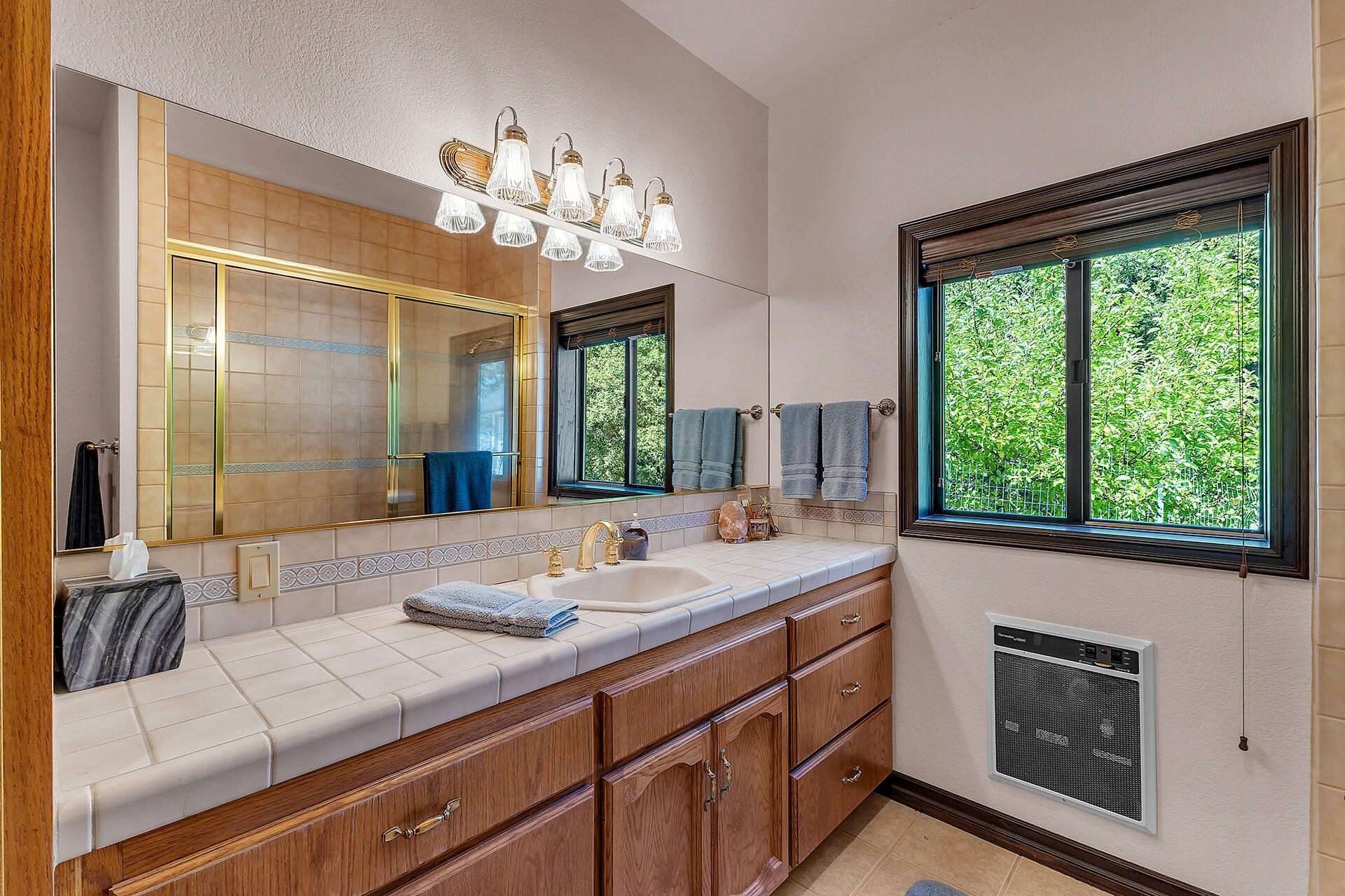 24740 Pioneer Road Idyllwild, CA 92549 - Photo 24 of 59 a bathroom with a sink and a large mirror