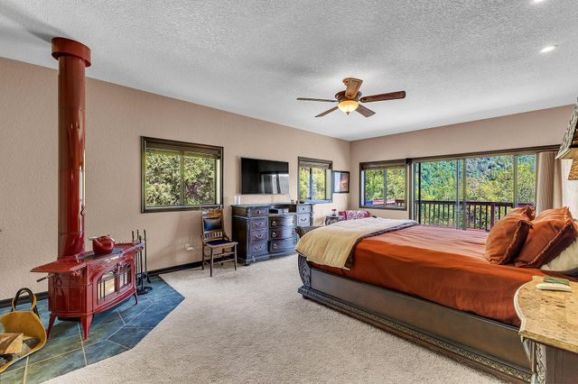 a bedroom with a bed and dresser