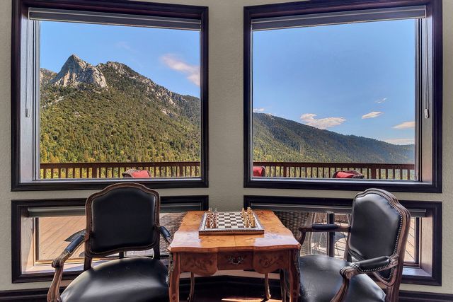 a view of a chairs and table in a balcony