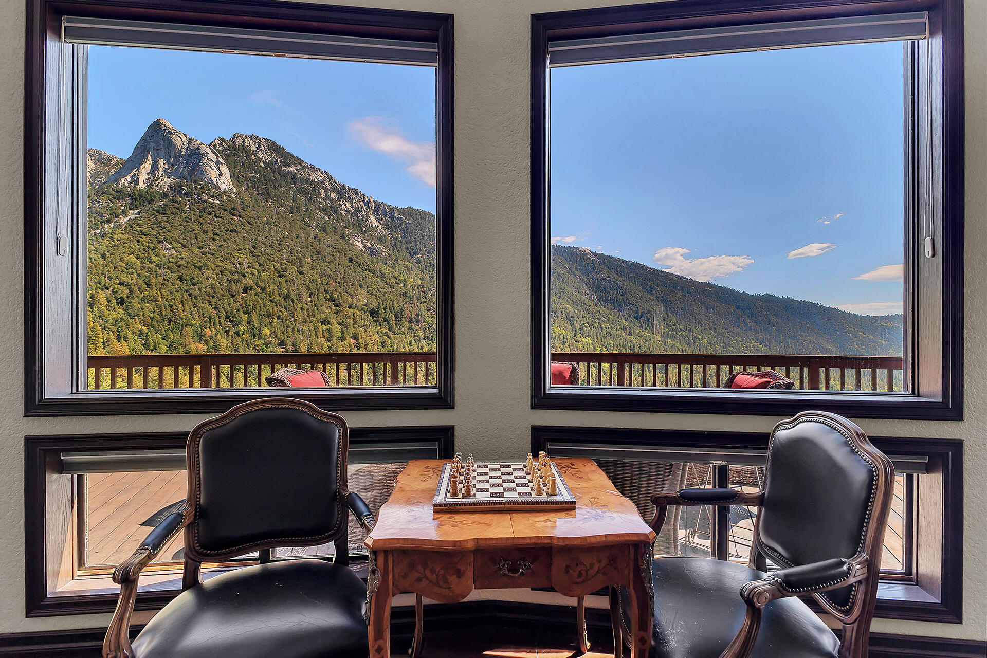 24740 Pioneer Road Idyllwild, CA 92549 - Photo 3 of 59 a view of a chairs and table in a balcony