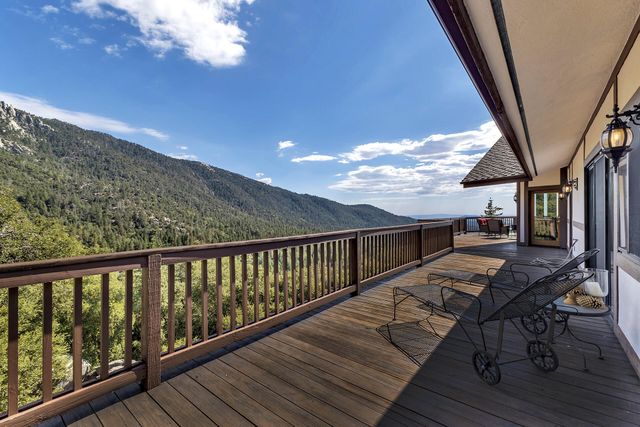 a view of balcony with chairs
