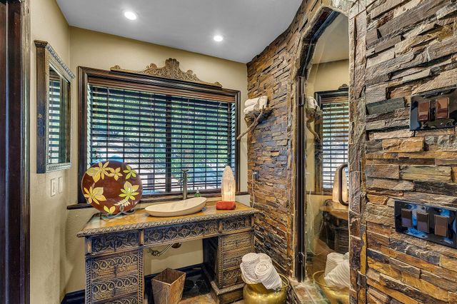 a bedroom with a bed and glass door