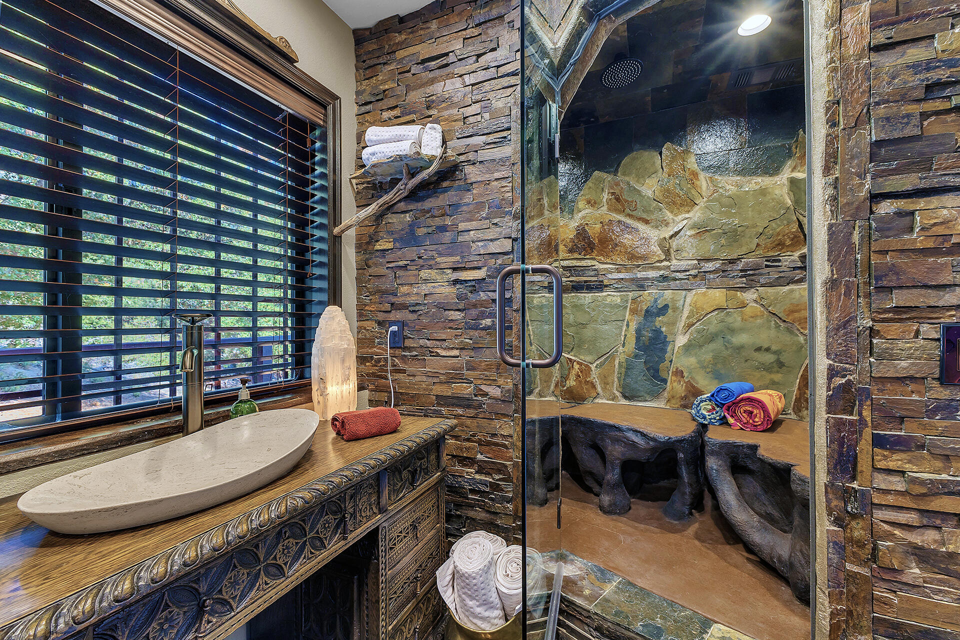 24740 Pioneer Road Idyllwild, CA 92549 - Photo 37 of 59 a bathroom with a granite countertop sink and a mirror