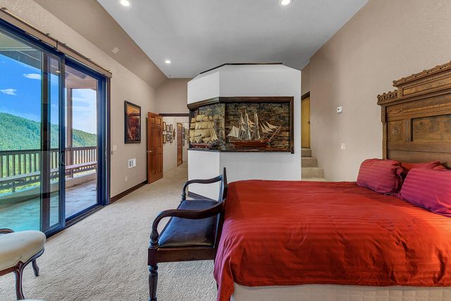 a livingroom with furniture and a flat screen tv