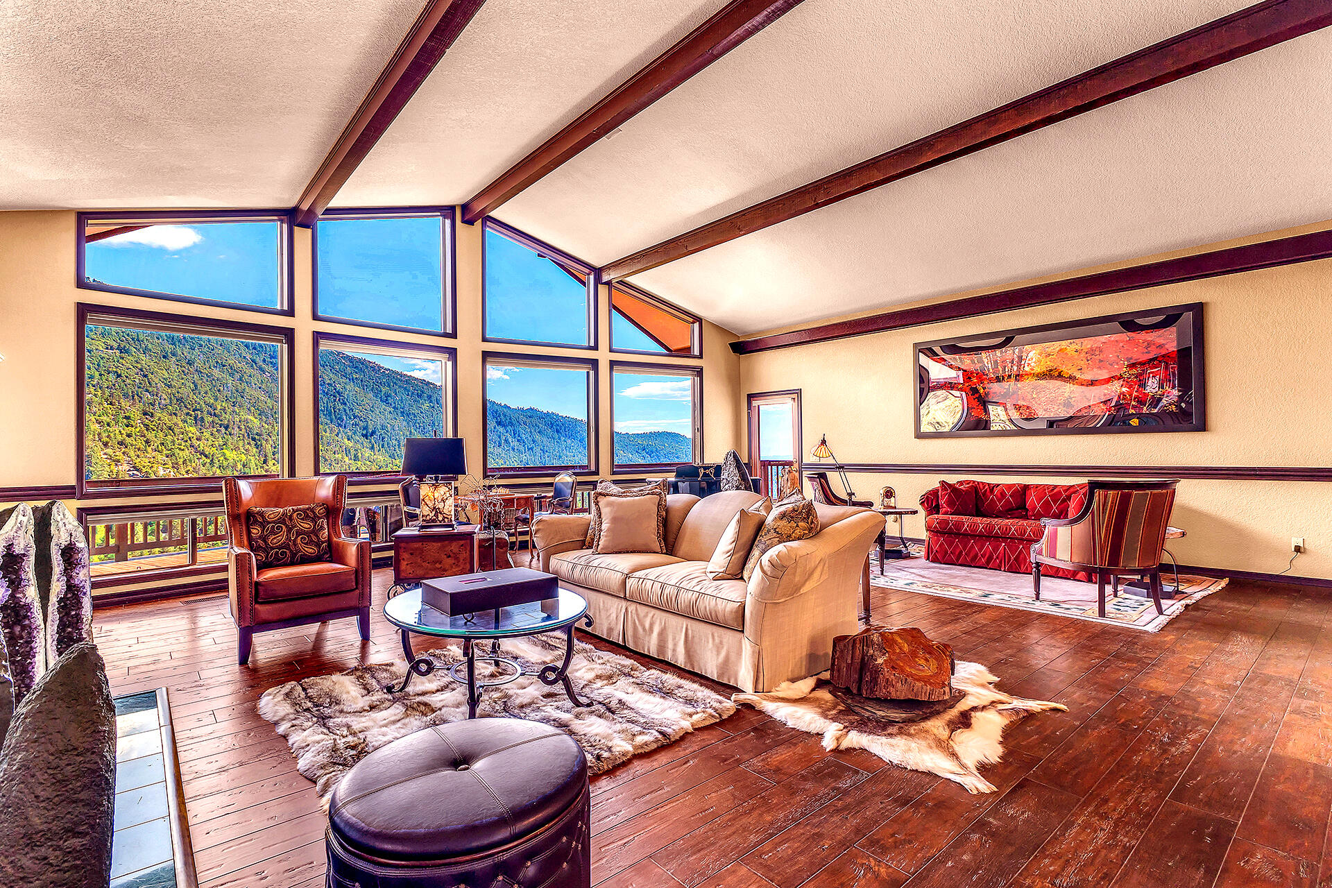 24740 Pioneer Road Idyllwild, CA 92549 - Photo 4 of 59 a living room with furniture a rug and a large window