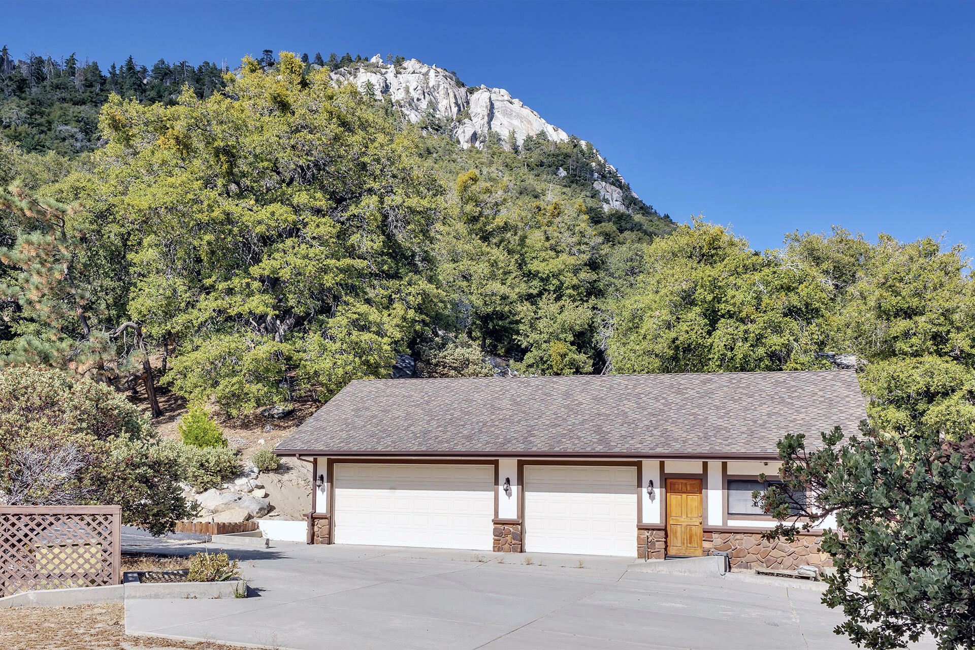24740 Pioneer Road Idyllwild, CA 92549 - Photo 54 of 59 a house with trees in the background