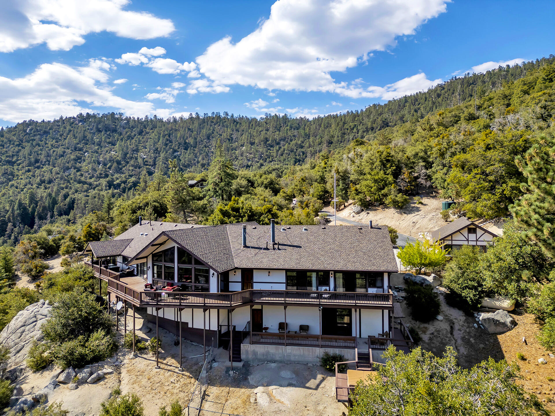 24740 Pioneer Road Idyllwild, CA 92549 - Photo 58 of 59 a view of a big house with a mountain in the background