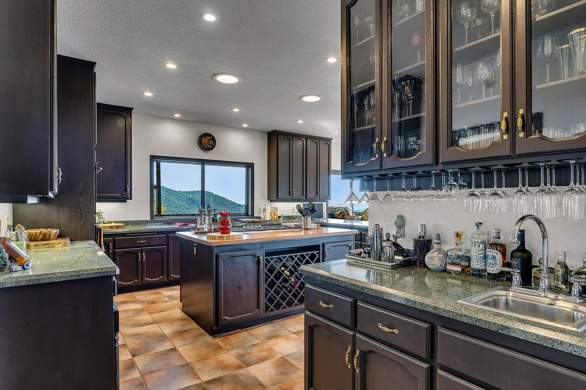 24740 Pioneer Road Idyllwild, CA 92549 - Photo 8 of 59 a kitchen with a stove and a sink