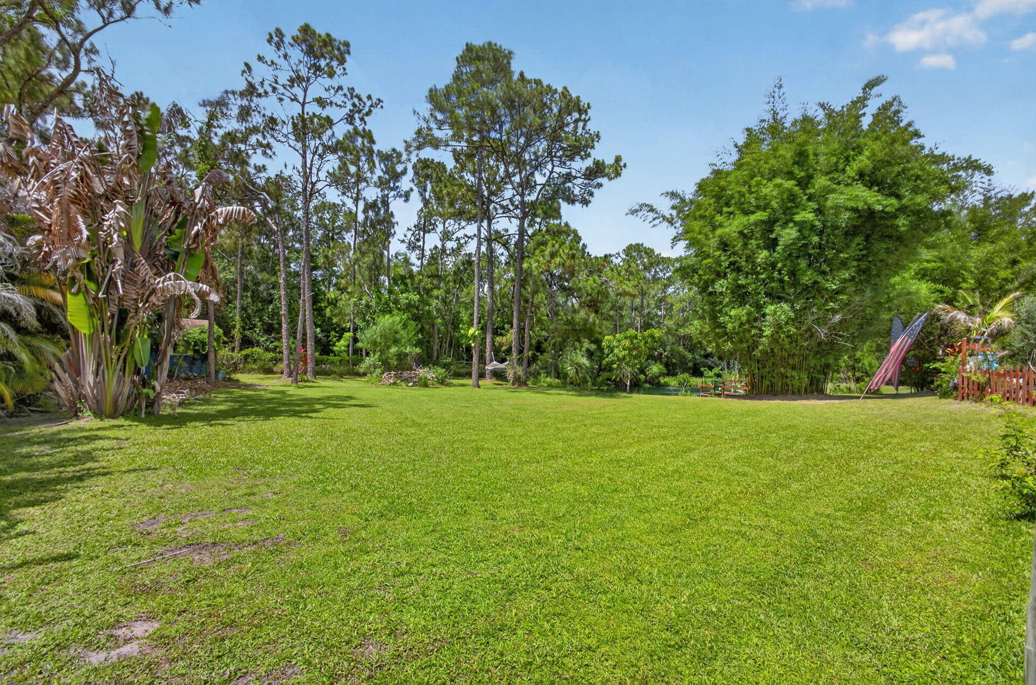 12558 165th Road North Jupiter, FL 33478 - Photo 15 of 67 a view of field with trees in the background