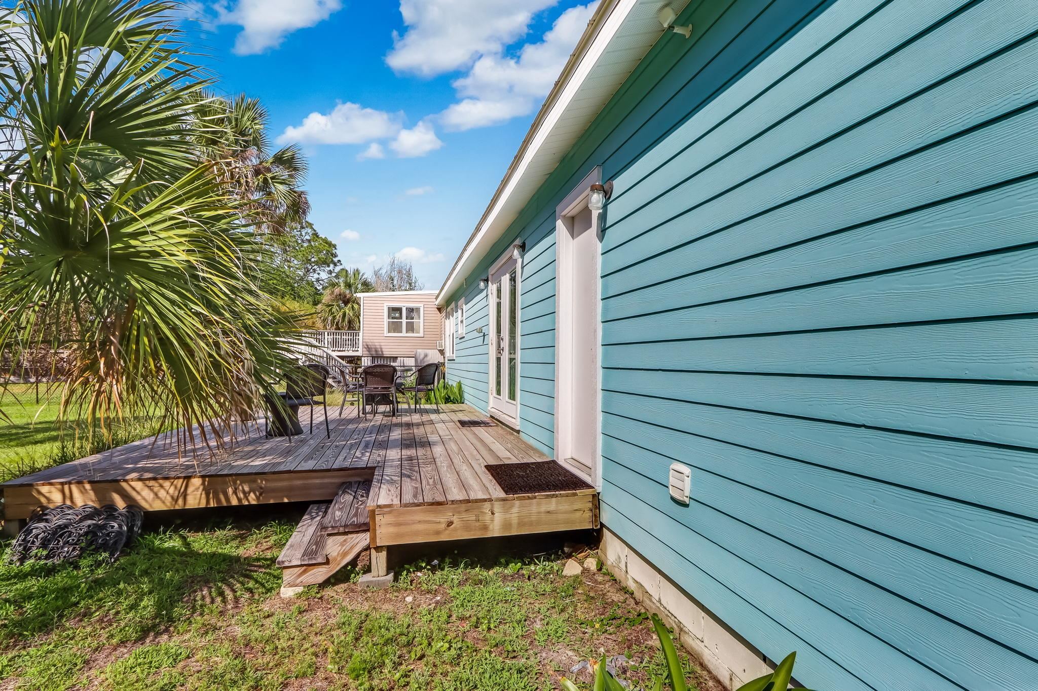 28 Atlantic Avenue St. Augustine, FL 32084 - Photo 20 of 23 a view of a backyard with chairs and wooden fence