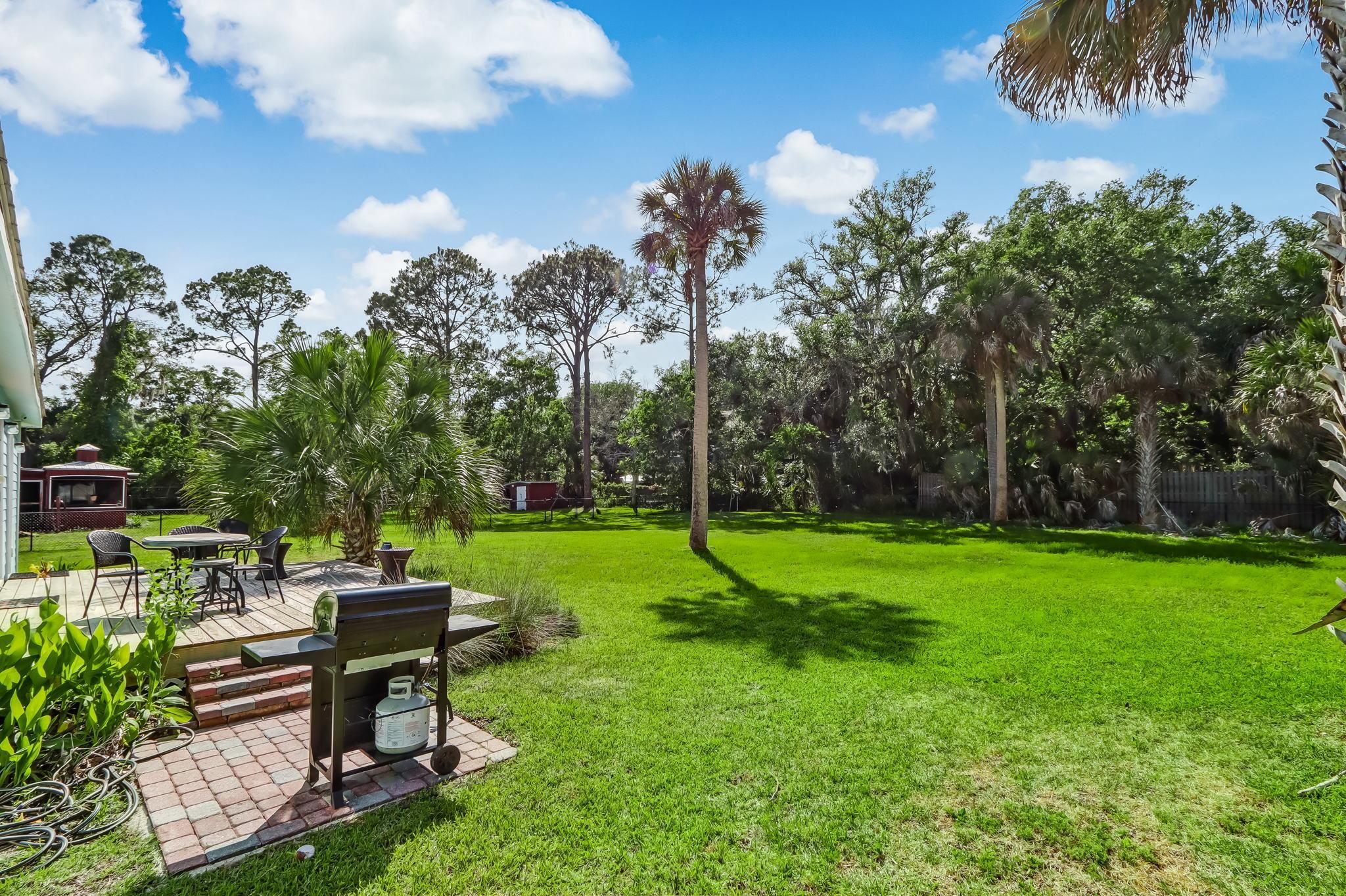 28 Atlantic Avenue St. Augustine, FL 32084 - Photo 22 of 23 a view of a bench in the garden near a lake