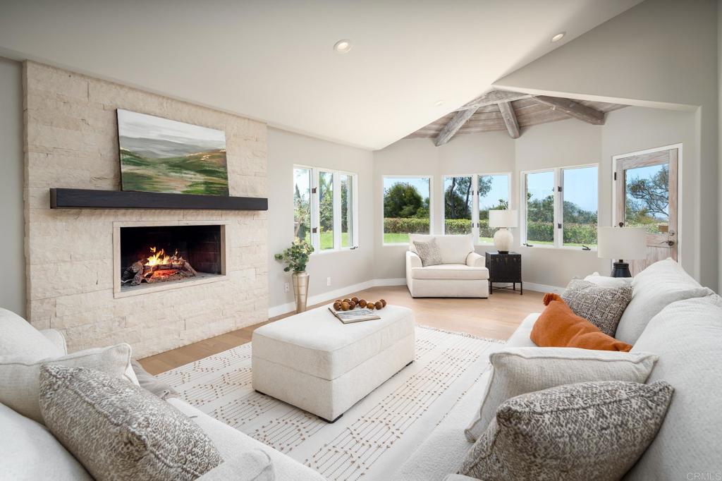 5002 El Acebo Rancho Santa Fe, CA 92067 - Photo 15 of 55 a living room with furniture and a fireplace