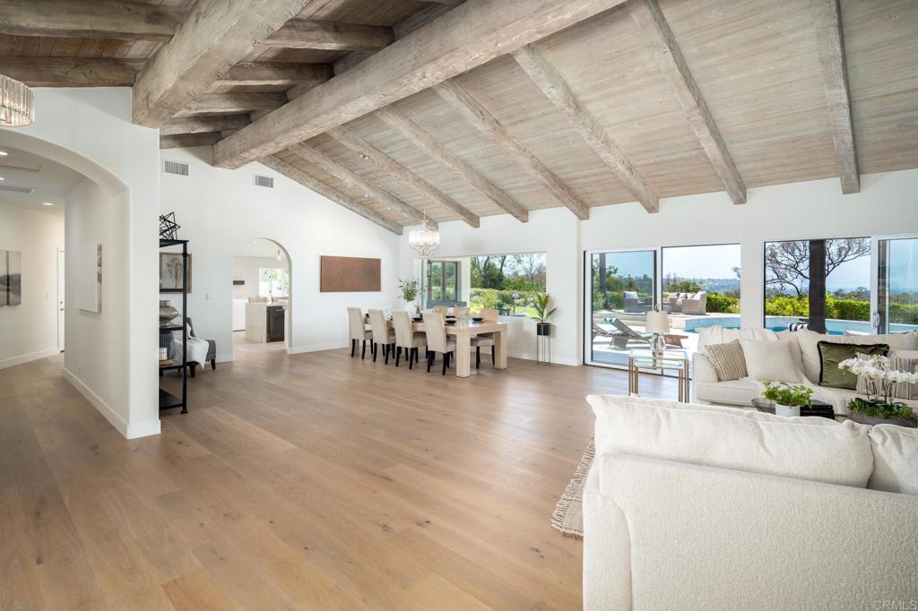 5002 El Acebo Rancho Santa Fe, CA 92067 - Photo 19 of 55 a living room with lots of furniture and kitchen view