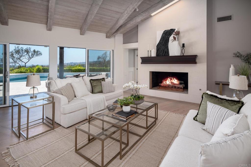 5002 El Acebo Rancho Santa Fe, CA 92067 - Photo 22 of 55 a living room with furniture and a fireplace