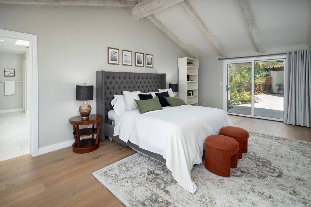 5002 El Acebo Rancho Santa Fe, CA 92067 - Photo 24 of 55 a bedroom with a bed and glass window
