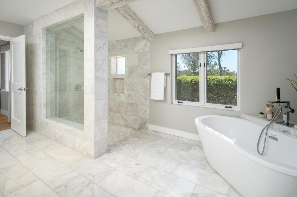 5002 El Acebo Rancho Santa Fe, CA 92067 - Photo 27 of 55 a bathroom with a tub shower and sink