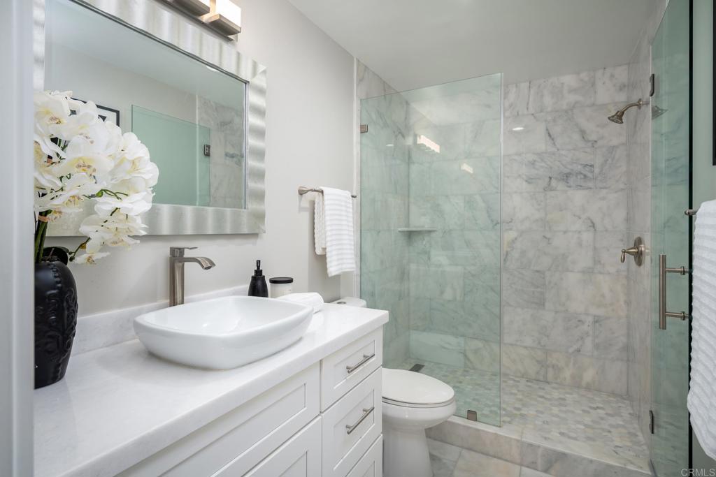 5002 El Acebo Rancho Santa Fe, CA 92067 - Photo 35 of 55 a bathroom with a sink toilet and shower