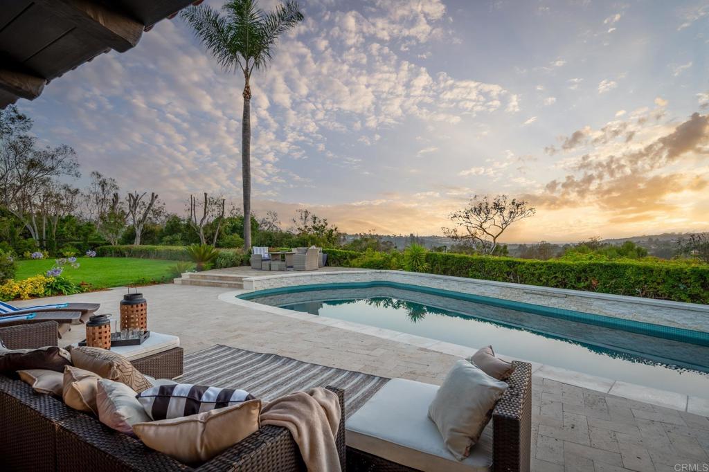 5002 El Acebo Rancho Santa Fe, CA 92067 - Photo 5 of 55 a view of swimming pool with outdoor seating and plants