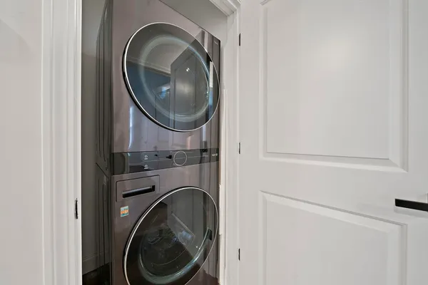 a close view of a utility room with dryer and washer