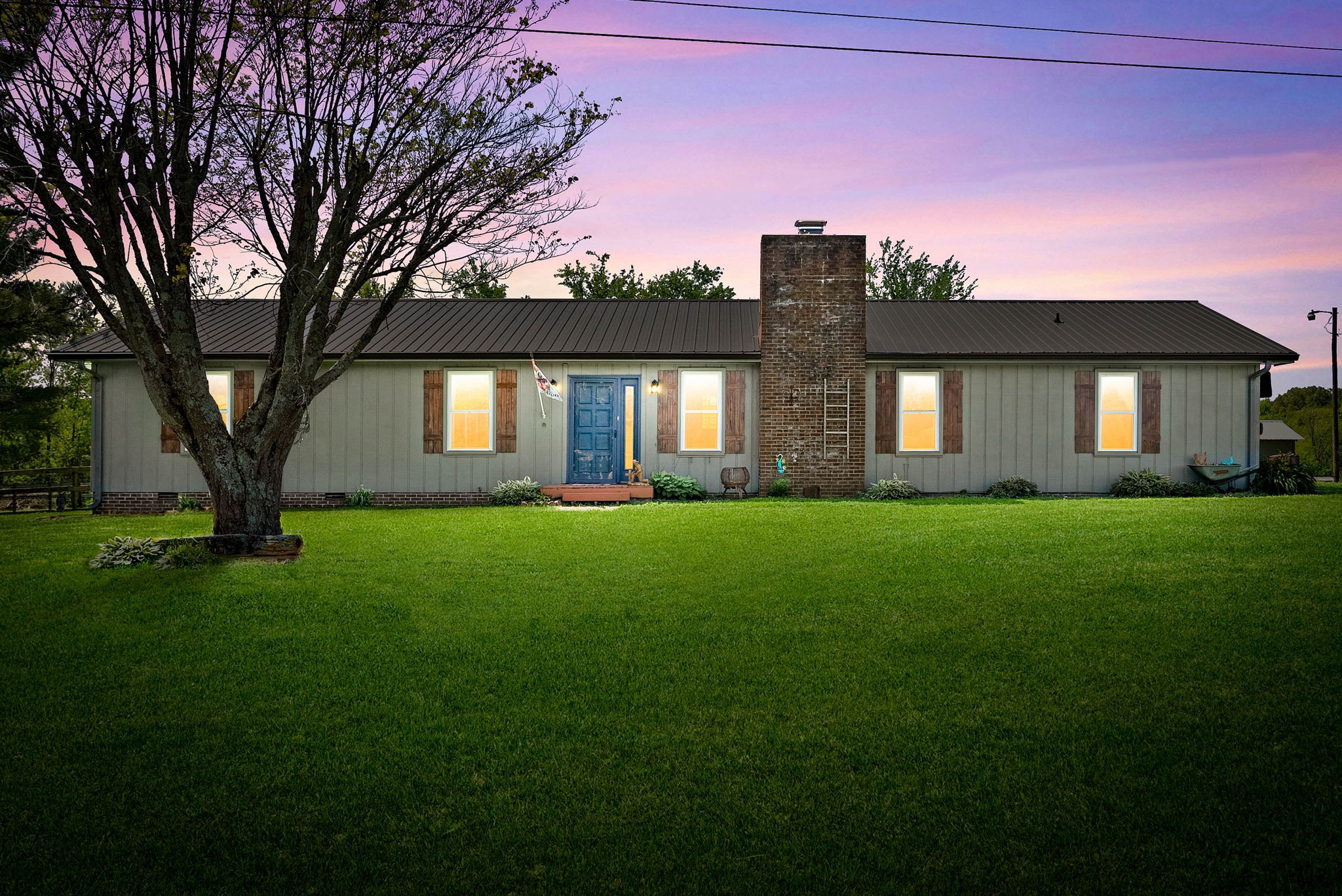 558 Bumpus Road Cunningham, TN 37052 - Photo 1 of 64 a front view of house with yard and outdoor seating