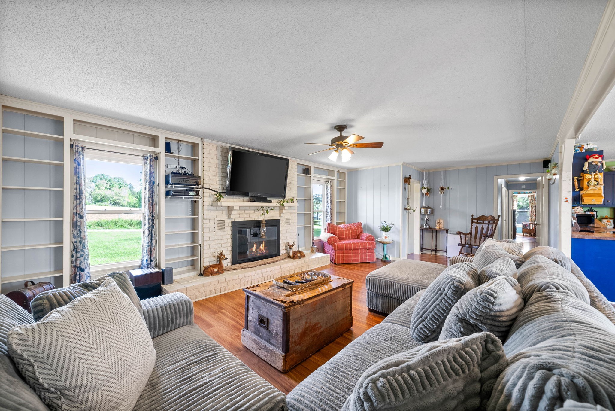 558 Bumpus Road Cunningham, TN 37052 - Photo 12 of 64 a living room with furniture fireplace and a flat screen tv