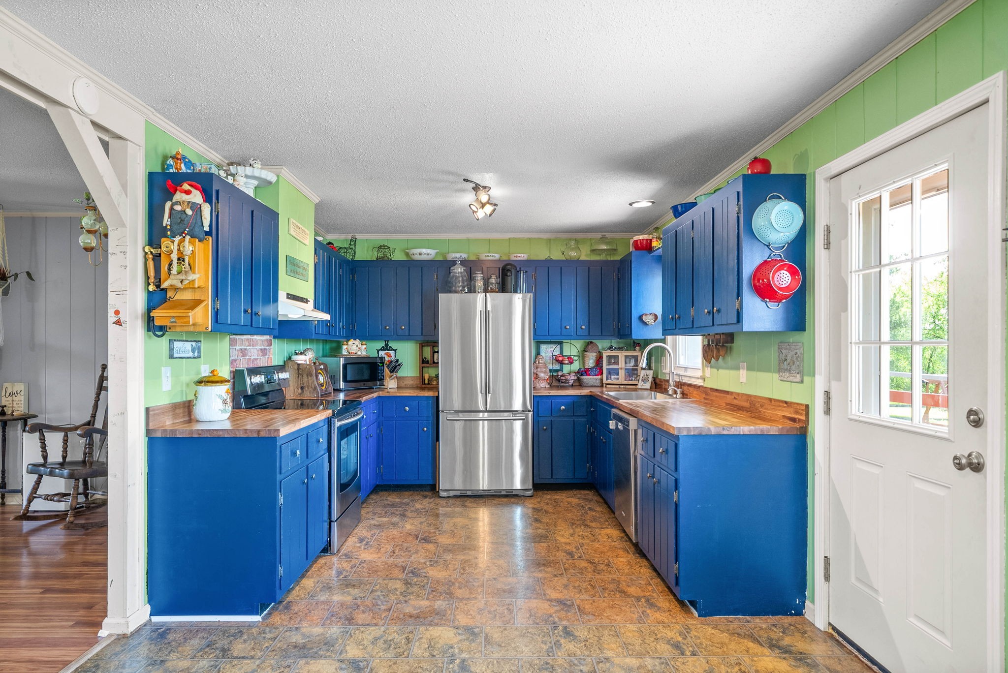 558 Bumpus Road Cunningham, TN 37052 - Photo 14 of 64 a kitchen with cabinets and wooden floor