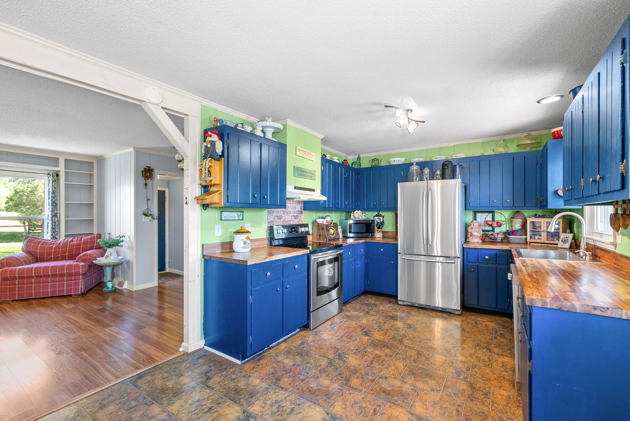 558 Bumpus Road Cunningham, TN 37052 - Photo 17 of 64 a kitchen with refrigerator and cabinets