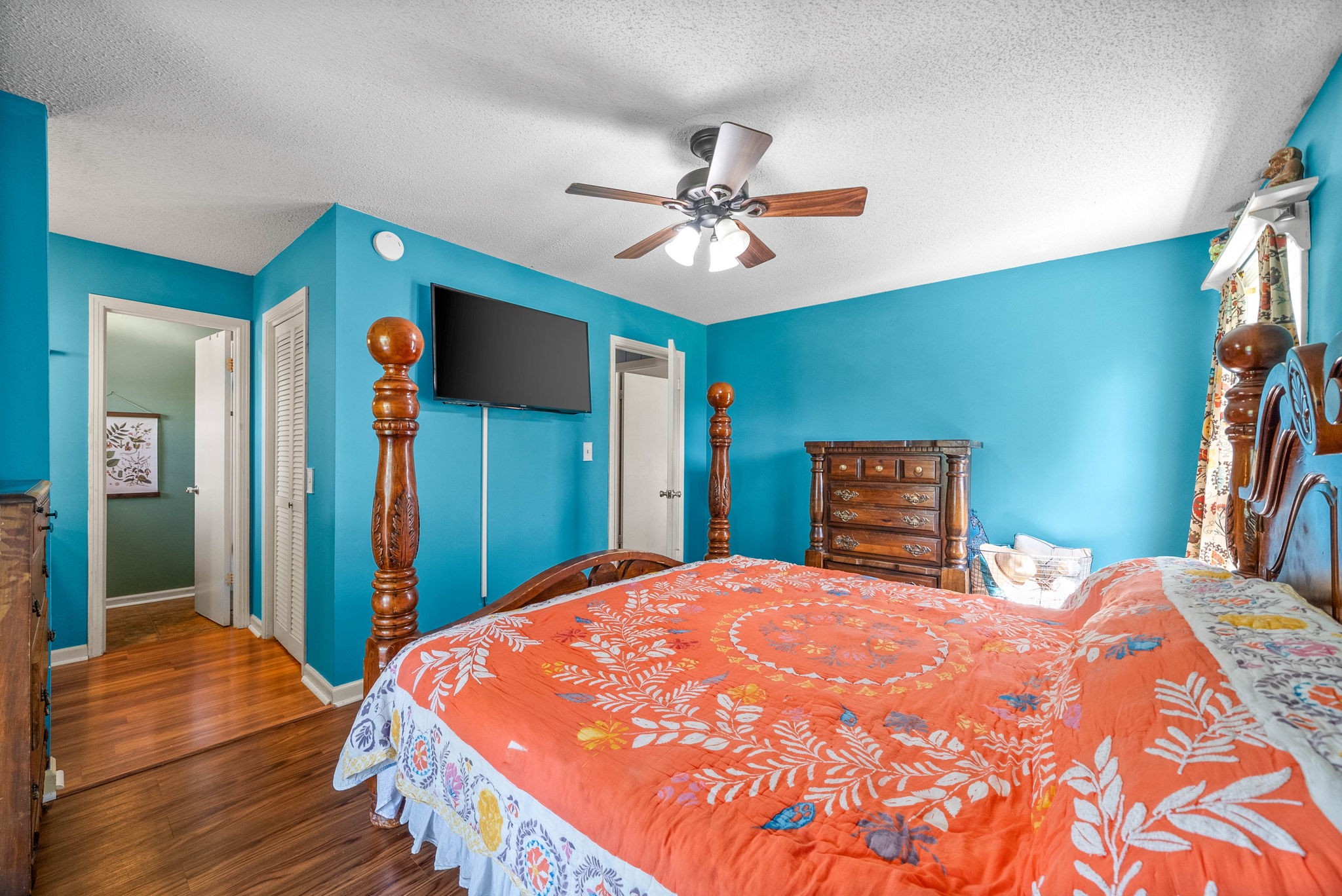 558 Bumpus Road Cunningham, TN 37052 - Photo 30 of 64 a bedroom with a bed and a chandelier