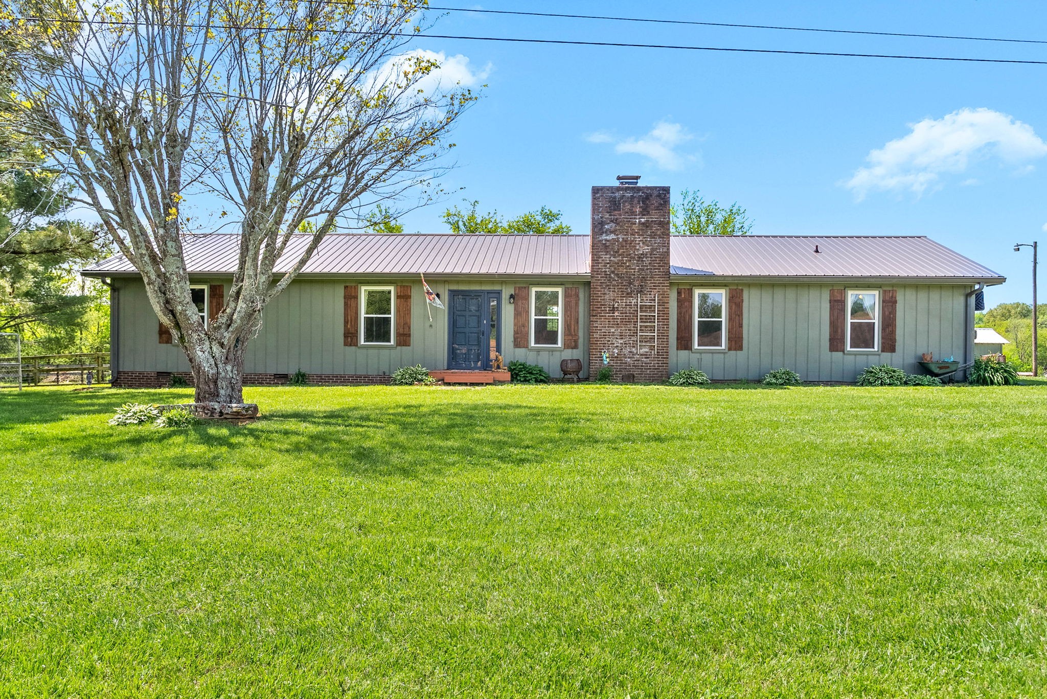 558 Bumpus Road Cunningham, TN 37052 - Photo 3 of 64 a house view with a garden space