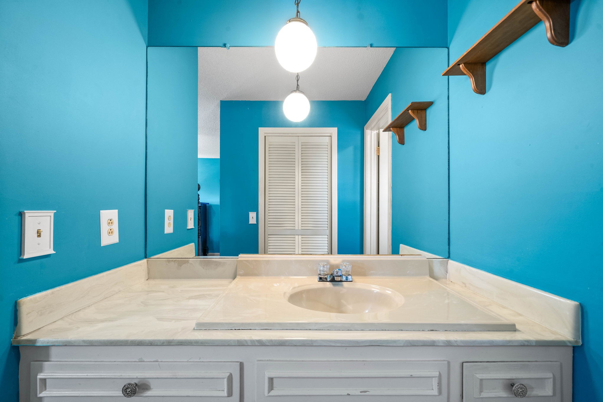 558 Bumpus Road Cunningham, TN 37052 - Photo 32 of 64 a bathroom with a sink vanity and a mirror