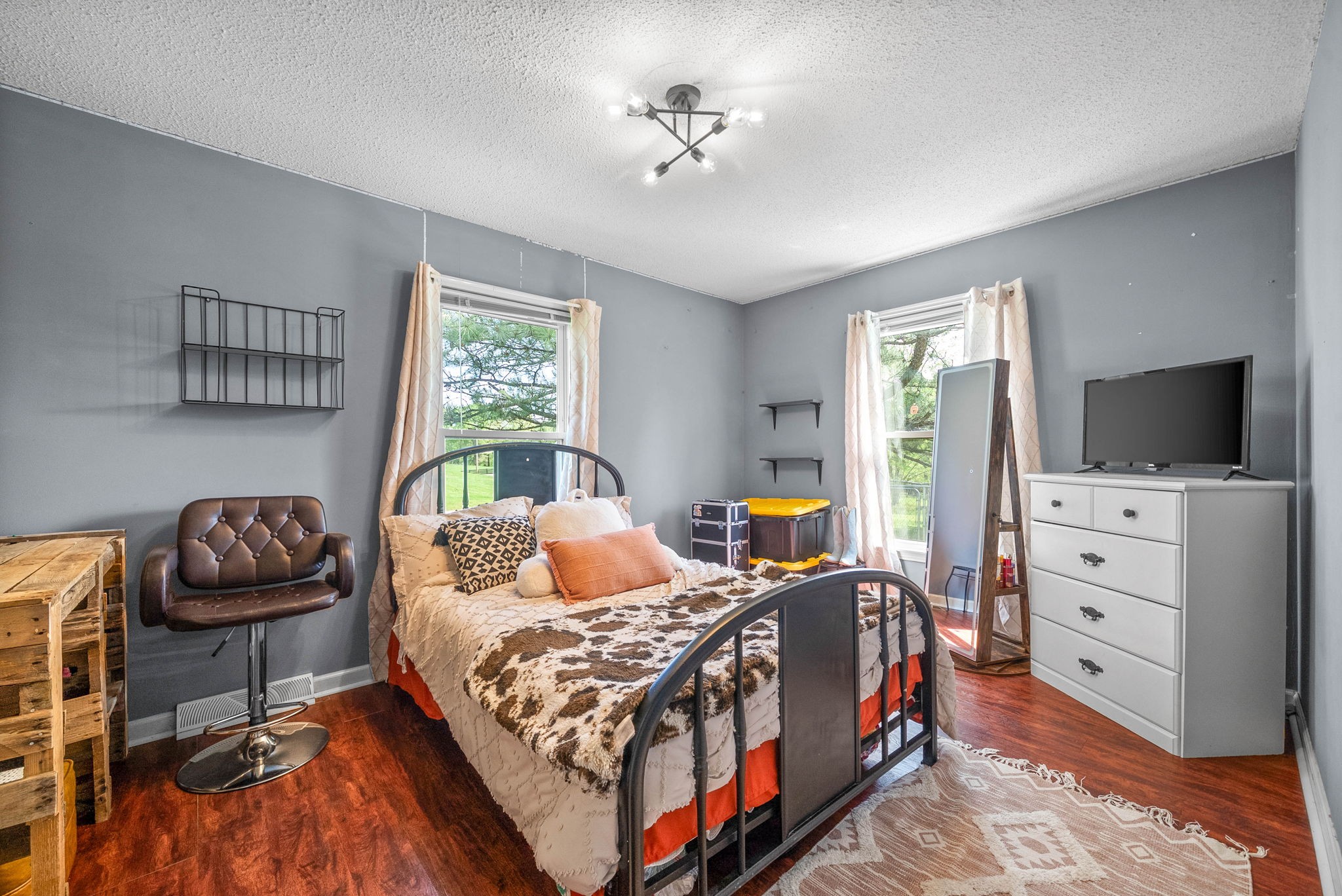 558 Bumpus Road Cunningham, TN 37052 - Photo 34 of 64 a bedroom with a bed and flat screen tv