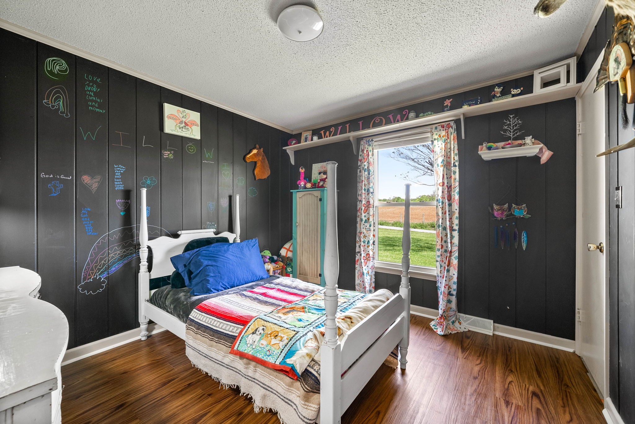 558 Bumpus Road Cunningham, TN 37052 - Photo 38 of 64 a bedroom with a bed and wooden floor