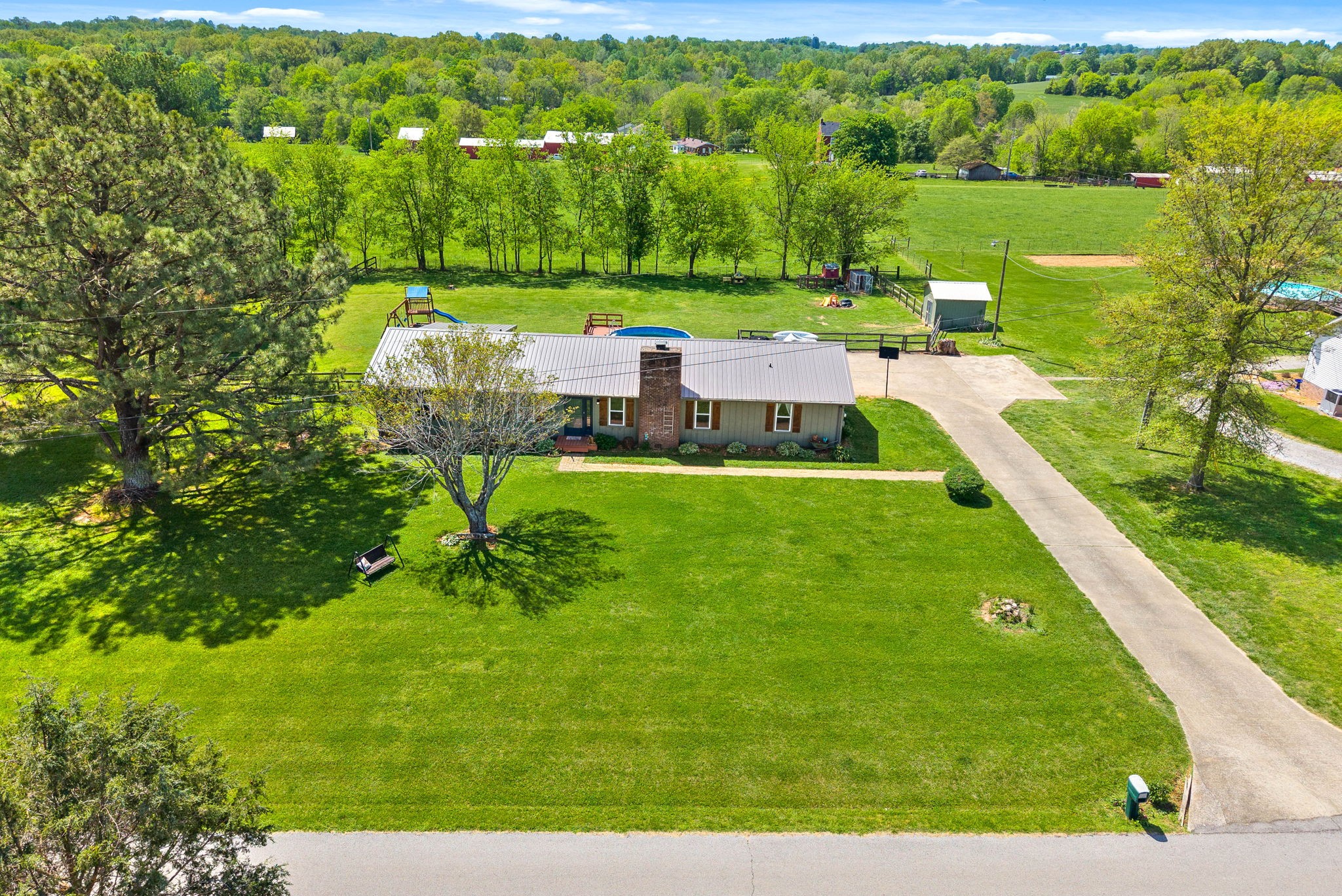 558 Bumpus Road Cunningham, TN 37052 - Photo 44 of 64 a view of a city with lawn chairs