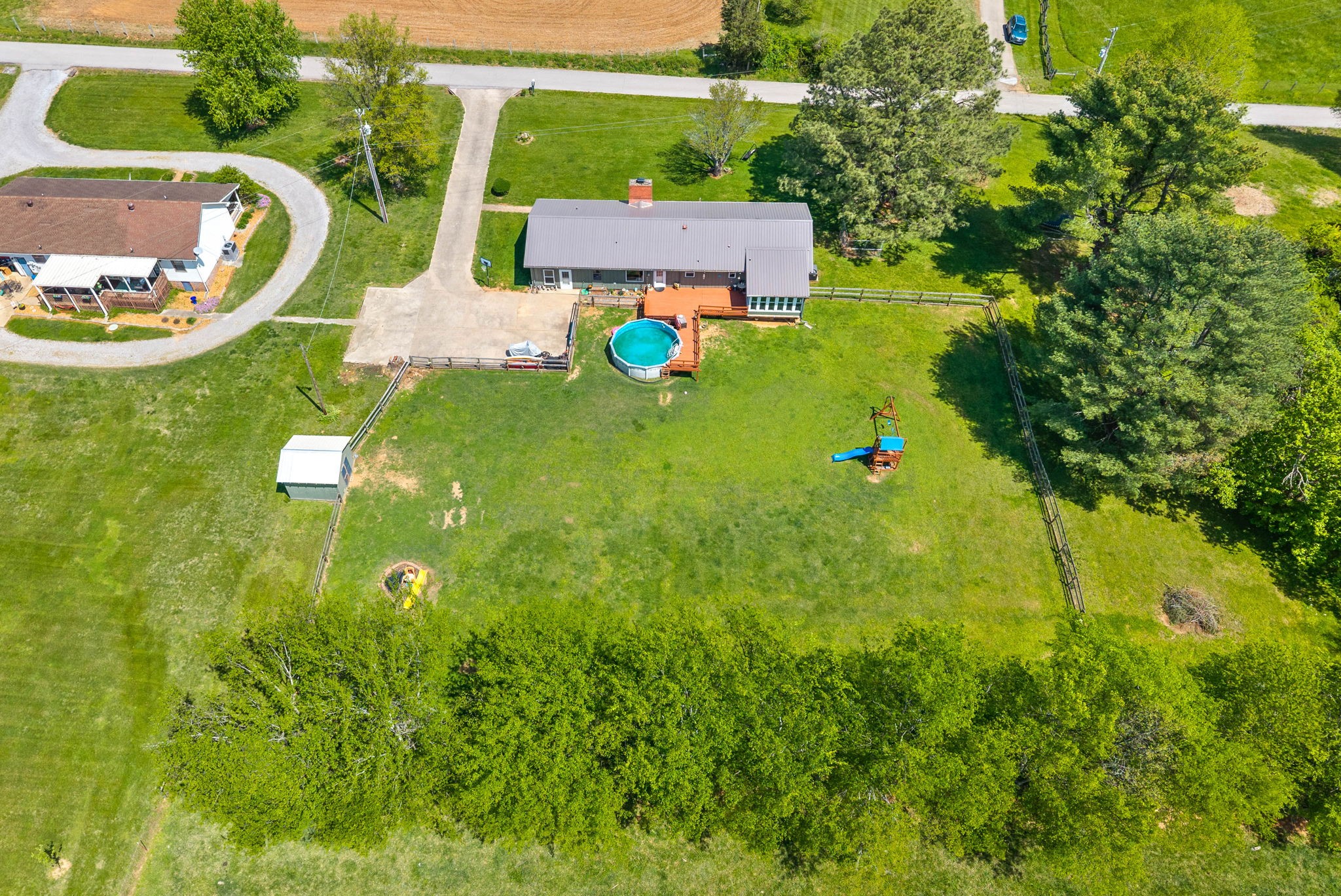 558 Bumpus Road Cunningham, TN 37052 - Photo 46 of 64 an aerial view of residential house with an outdoor space and seating