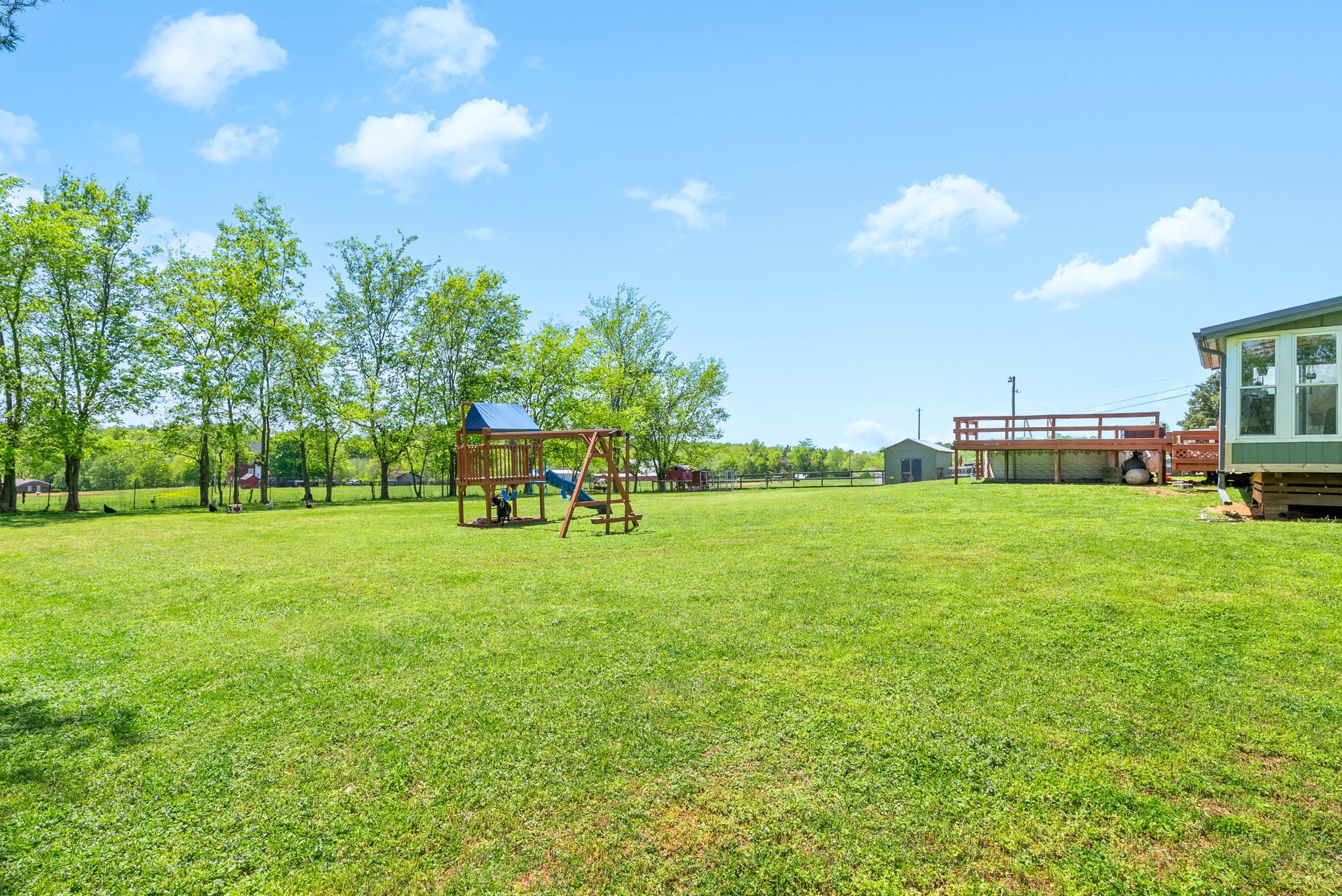 558 Bumpus Road Cunningham, TN 37052 - Photo 52 of 64 a childrens park with lots of swings and slides