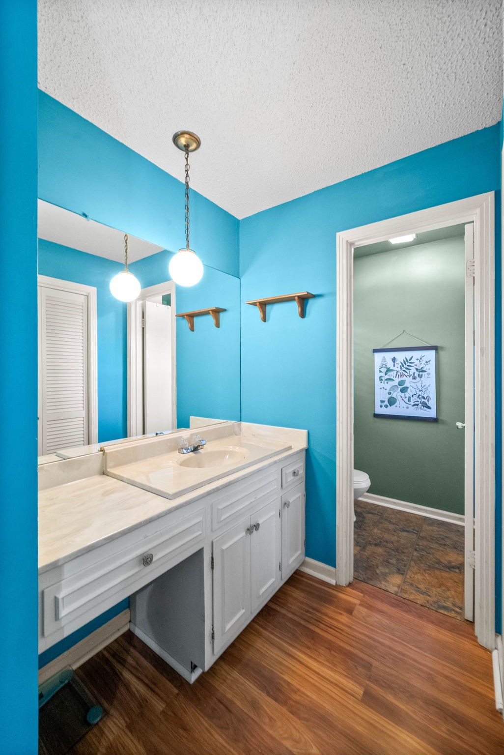 558 Bumpus Road Cunningham, TN 37052 - Photo 58 of 64 a bathroom with a sink a vanity and a large mirror